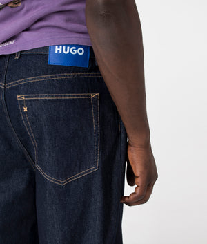 HUGO Wide Fit Mason Jeans in Dark Blue, 100% Cotton at EQVVS Menswear. Back tab model shot. 