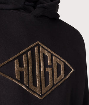 HUGO  Relaxed Fit Dacorolo Hoodie in Black . Shot at EQVVS. Front logo shot 