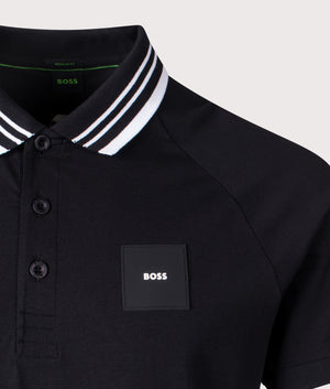 BOSS Paddy Paddy Rib Polo Shirt in Black, 100% Cotton. Shot at EQVVS. Front logo shot 