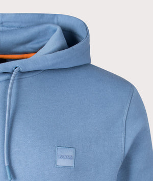 Wetalk Hoodie in Light/Pastel Blue from BOSS. Detail angle shot at EQVVS.