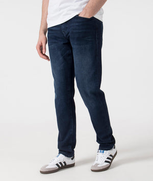 BOSS Tapered Fit ONYX Jeans in Dark Blue . Shot at EQVVS. Front angle shot 