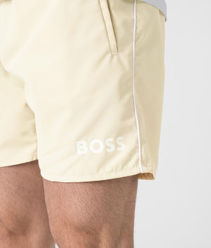 BOSS Starfish Swim Shorts in Open White . Shot at EQVVS. Front angle logo shot