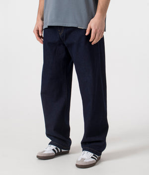 Carhartt WIP Landon Pants in dark blue. Shot at EQVVS, side shot. 