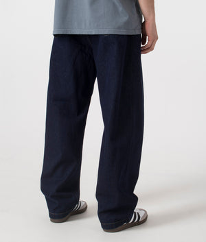 Carhartt WIP Landon Pants in dark blue. Shot at EQVVS, back shot. 