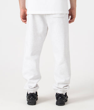 Carhartt WIP Relaxed Fit Chase Joggers in Ash Heather/Gold. Back angle model shot at EQVVS.