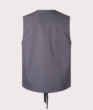 Carhartt WIP Balto Vest in Graphite. Back angle shot at EQVVS.