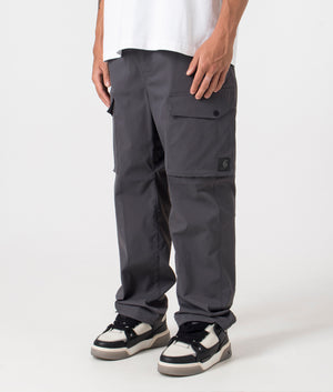 Carhartt WIP Relaxed Fit Balto Cargo Pants in Graphite at EQVVS Menswear front angle shot