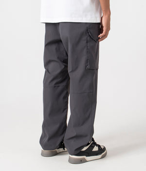 Carhartt WIP Relaxed Fit Balto Cargo Pants in Graphite at EQVVS Menswear back angle shot