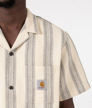 Carhartt WIP Short Sleeve Dodson Shirt in Natural. Detail angle model shot at EQVVS.