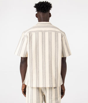 Carhartt WIP Short Sleeve Dodson Shirt in Natural. Back angle model shot at EQVVS.