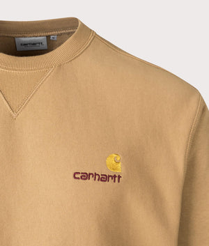 Carharrt WIP Relaxed Fit American Script Sweatshirt in 2FSXX Peanut. At EQVVS Menswear. Front logo shot