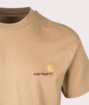 CArhartt WIP Relaxed Fit American Script T-Shirt in Peanut. Detail angle shot at EQVVS.