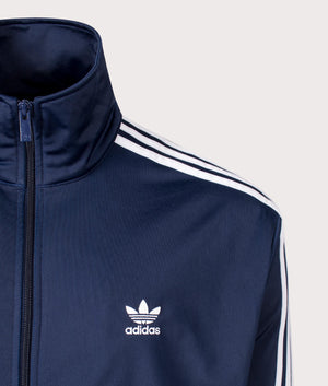 The adidas Originals Firebird Track Top in night indigo. Detailed shot at EQVVS.