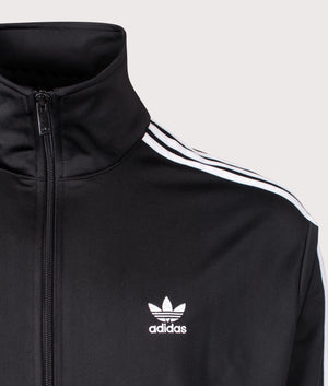 adidas Originals Firebird Track Top in Black and White at EQVVS Menswear. Detailed logo shot. 