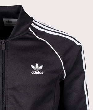 Adidas Originals Slim Fit Adicolor Classics SST Track Top in Black/White. Shot at EQVVS.  Front logo shot