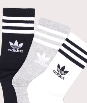 adidas Originals 3 stripe crew socks in White/Medium Grey/Black at EQVVS. Detailed logo shot. 