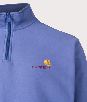 Carhartt WIP Relaxed Fit Half Zip American Script Sweatshirt in Blue Iris at EQVVS. Detailed logo shot. 