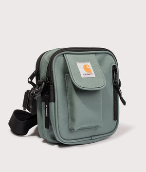 Carhartt WIP Small Essentials Bag in Silver Pine Green. EQVVS Angle Shot.