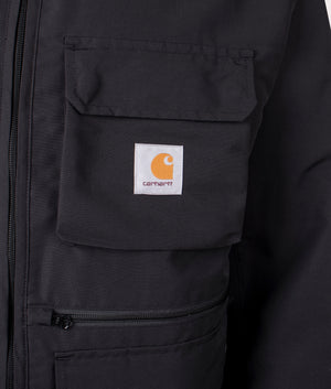 Carhartt WIP Irwin Jacket in Black at EQVVS. Detailed logo shot. 