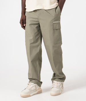 MKI Relaxed Fit Ripstop Cargo Pants in Sage Green. Side angle model shot at EQVVS.