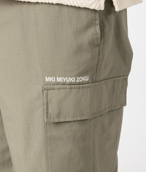 MKI Relaxed Fit Ripstop Cargo Pants in Sage Green. Detail angle model shot at EQVVS.