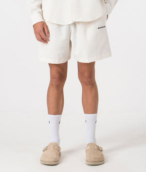 MKI Relaxed Fit Seersucker Shorts in Off White. Front angle model shot at EQVVS.