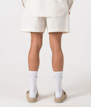 MKI Relaxed Fit Seersucker Shorts in Off White. Back angle model shot at EQVVS.