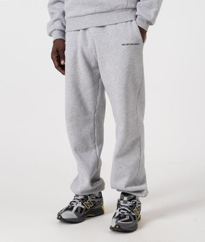 MKI Relaxed Fit Uniform Joggers in Grey. Side angle model shot at EQVVS.