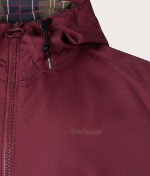 Barbour Lifestyle Barbour Hooded Domus Waterproof Jacket in Bordeaux. At EQVVS Menswear. Front logo shot