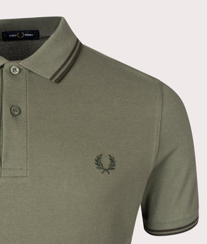 The Twin Tipped Fred Perry Polo Shirt in Laurel Wreath Green by Fred Perry. EQVVS Shot.