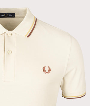 Fred Perry Twin Tipped Polo Shirt in Oatmeal/Honeycomb/Whiskey Brown. Shot at EQVVS. Detail image.