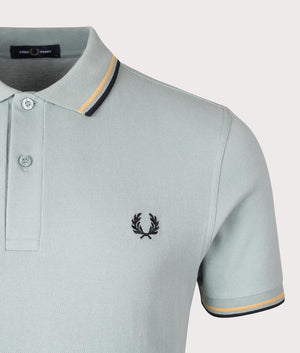 Fred Perry Twin Tipped Fred Perry Polo Shirt in Silver Blue, 100% cotton at EQVVS Menswear. Detailed logo Shot. 