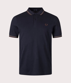 The Twin Tipped Fred Perry Polo Shirt in Navy/Laurel Wreath Green/Carrington Road Brick. Front angle shot at EQVVS.
