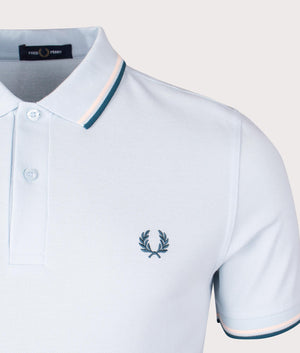 Fred Perry Twin Tipped Polo Shirt in Light Ice, 100% Cotton at EQVVS. Detail logo Shot.