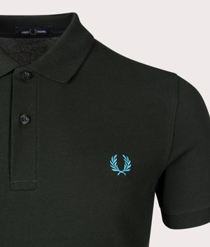 Fred Perry Classic Polo Shirt in Night Green/Runaway Ocean Blue, 100% Cotton at EQVVS. Logo Detailed Shot. 