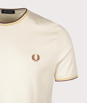 Fred Perry Twin Tipped T-Shirt in Oatmeal/Honeycomb/Whisky Brown, 100% Cotton at EQVVS. Detailed logo shot. 