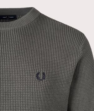 Fred Perry Waffle Stich Jumper in Field Green, 100% cotton. At EQVVS Menswear. Logo shot