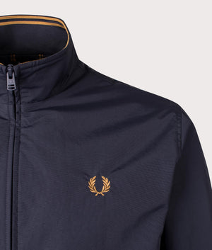 Fred Perry Brentham Jacket in Navy at EQVVS. Detailed logo shot. 