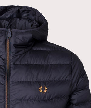 Insulated Hooded Jacket by Fred Perry in navy. Shot at EQVVS. Detail shot. 