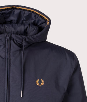 Hooded Brentham Jacket in navy by Fred Perry. Shot at EQVVS. Detail shot. 