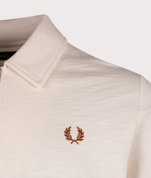 Fred Perry Quarter Zip Collar Sweatshirt in 560 Ecru, 100% Cotton. At EQVVS Menswear. Front logo shot