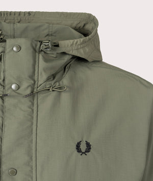 Fred Perry Short Snorkel Parka for men in Laurel Wreath Green at EQVVS Logo Shot