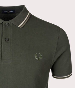 Fred Perry Twin-Tipped Polo Shirt in Hunting Green, 100% cotton at EQVVS. Detailed logo shot. 