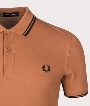 Fred Perry Twin Tipped Polo Shirt in Marmalade. Shot at EQVVS. Detail shot. 