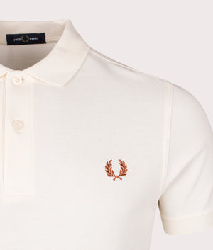 The Fred Perry Polo Shirt in Ecru. Shot at EQVVS. Detail shot.