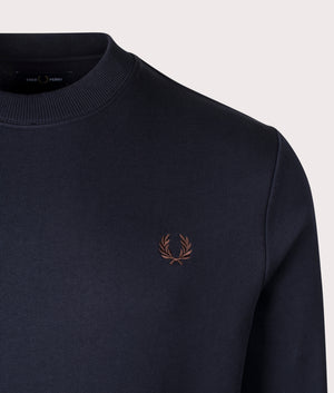 Crew Neck Sweatshirt in Navy by Fred Perry. Shot at EQVVS. Detail shot. 