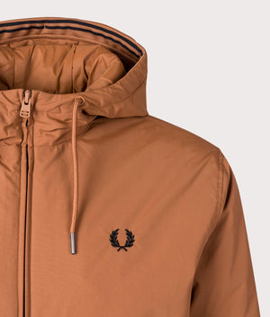 Fred Perry Hooded Brentham Jacket in Marmalade at EQVVS. Detailed Logo shot. 