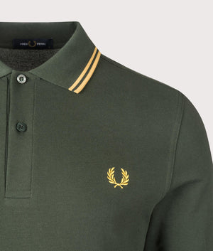 Fred Perry Long Sleeve Twin Tipped Polo Shirt in Court Green/Honeycomb. Shot at EQVVS.  Detail shot.