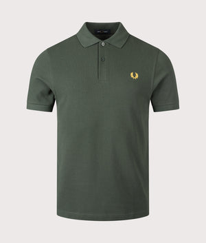 Fred Perry Polo Shirt in Green, shot at EQVVS. Front shot. 