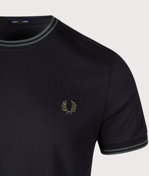 Twin Tipped T-Shirt in black/court green by Fred Perry. Shot at EQVVS. Detail shot.